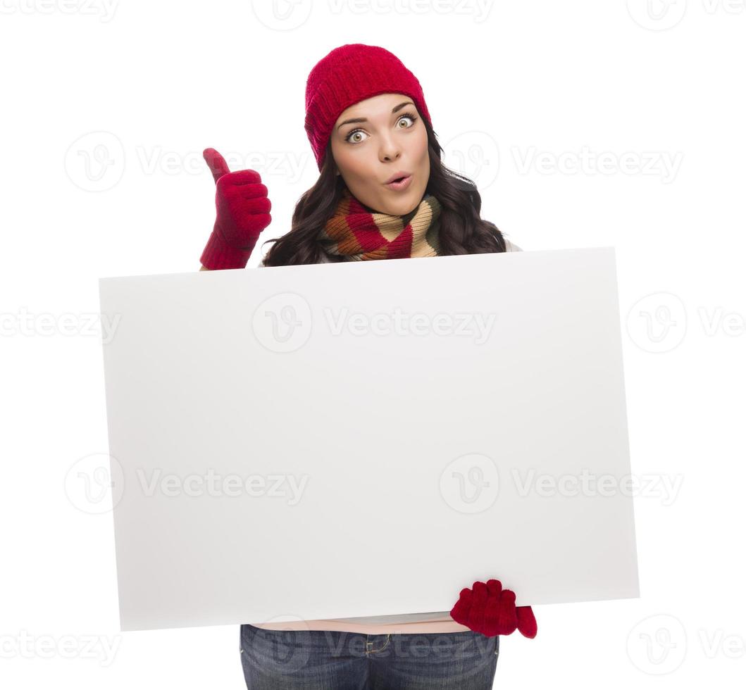 Excited Girl Holds Blank Sign and gives Thumbs Up Gesture photo
