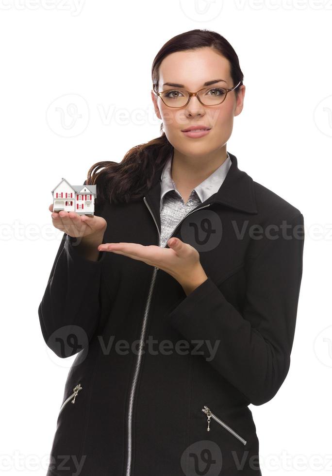 Mixed Race Businesswoman Holding Small House to the Side photo