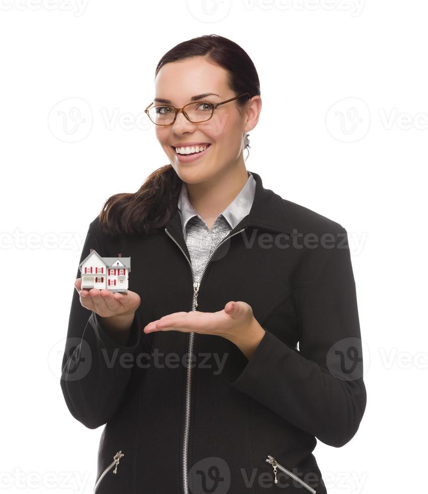 Mixed Race Businesswoman Holding Small House to the Side photo