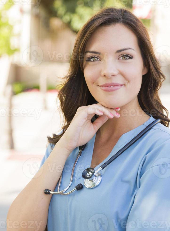 Young Adult Woman Doctor or Nurse Portrait Outside photo