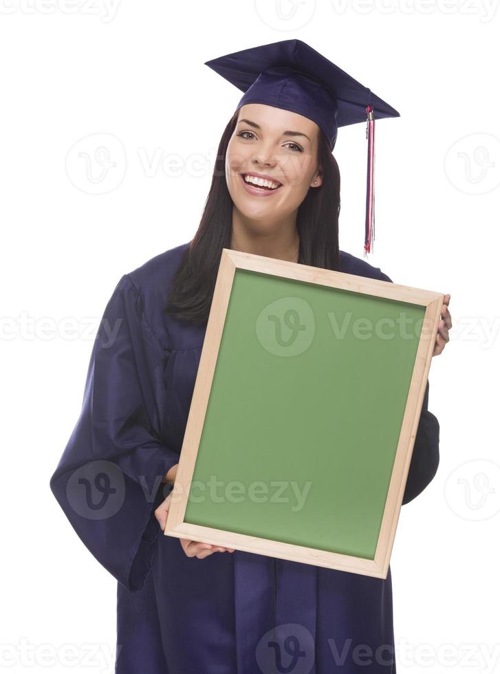 Mixed Race Female Graduate in Cap and Gown Holding Chalkboard photo