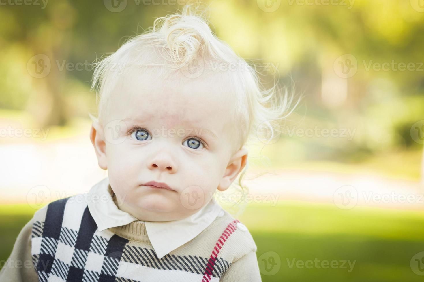 Adorable Blonde Baby Boy Outdoors at the Park photo