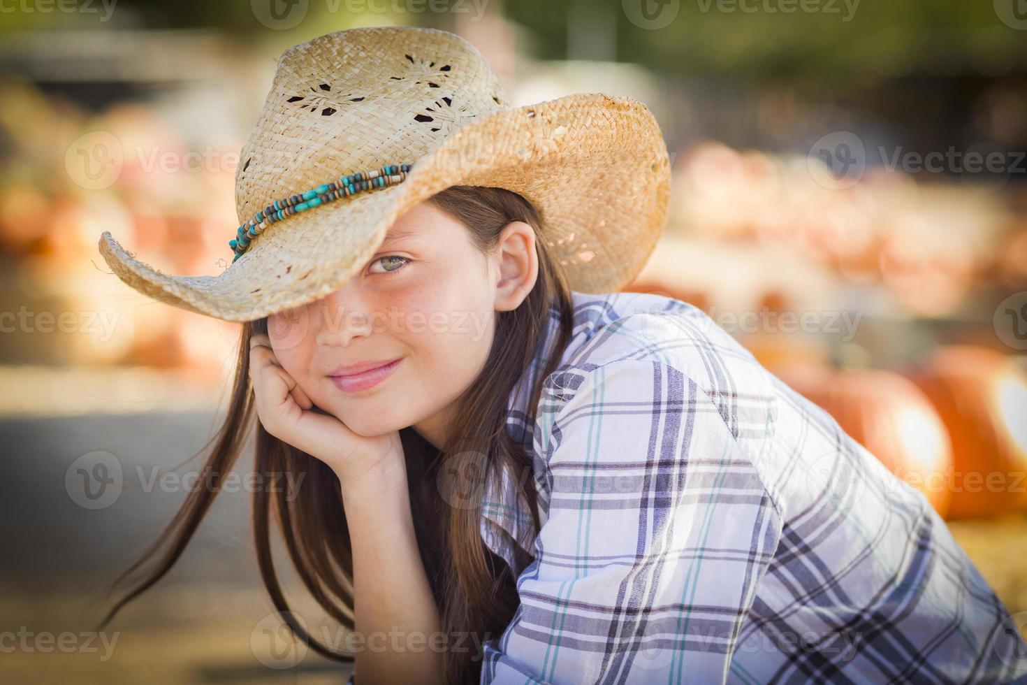 Pretty Preteen Girl Portrait at the Pumpkin Patch photo