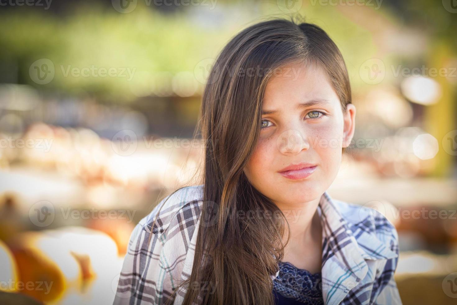 Preteen Girl Portrait at the Pumpkin Patch photo