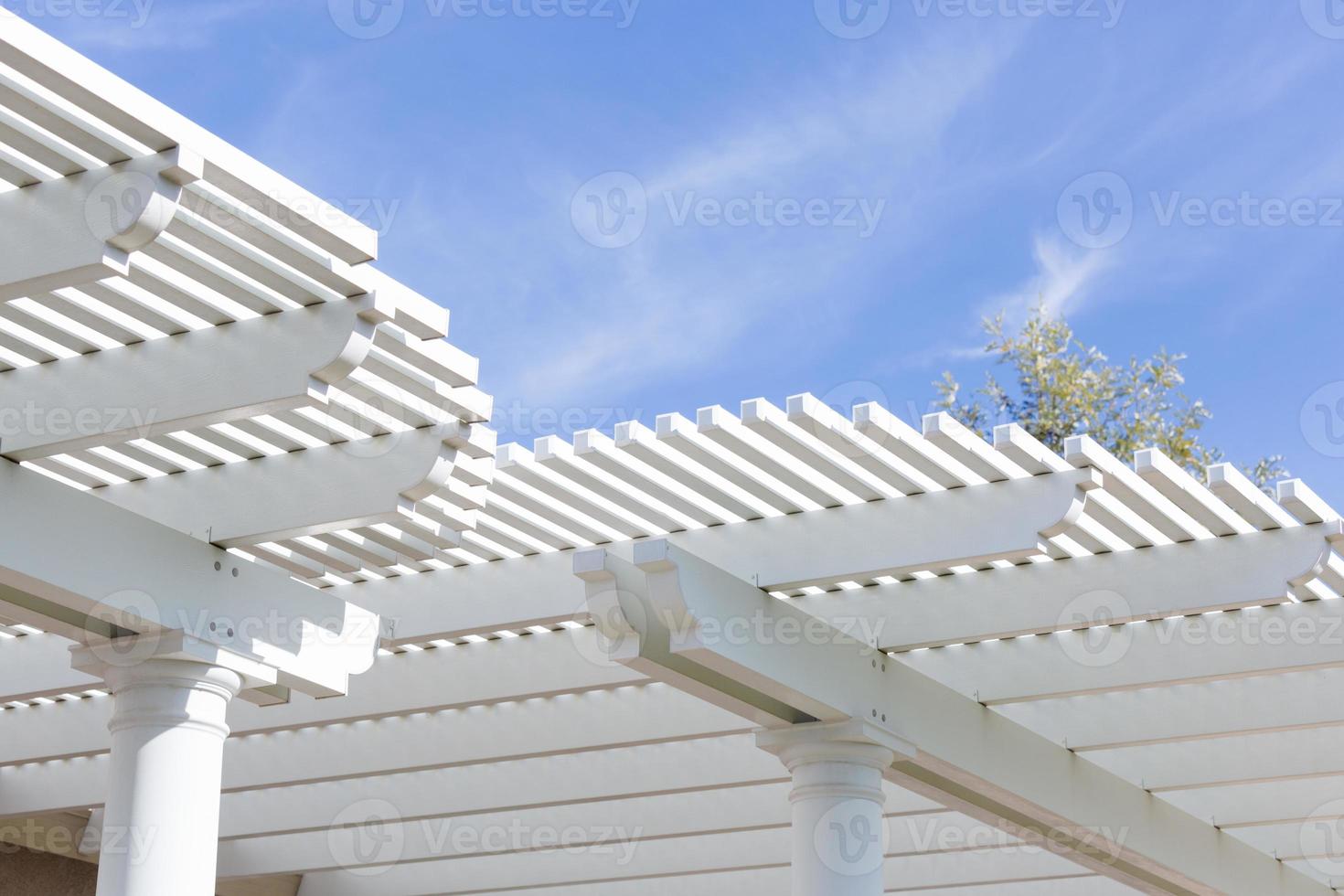 Beautiful House Patio Cover Against the Blue Sky. photo