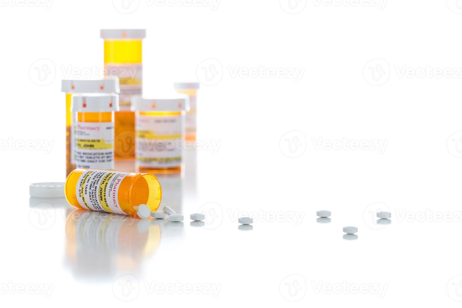 Non-Proprietary Medicine Prescription Bottles and Spilled Pills Isolated on White photo