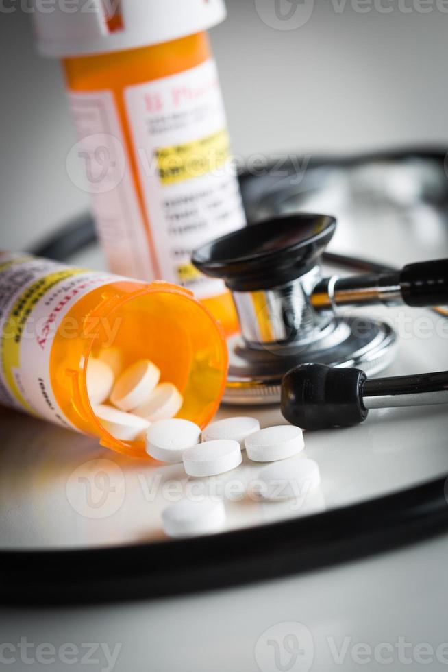 Non-Proprietary Medicine Prescription Bottles and Spilled Pills with Stethoscope photo