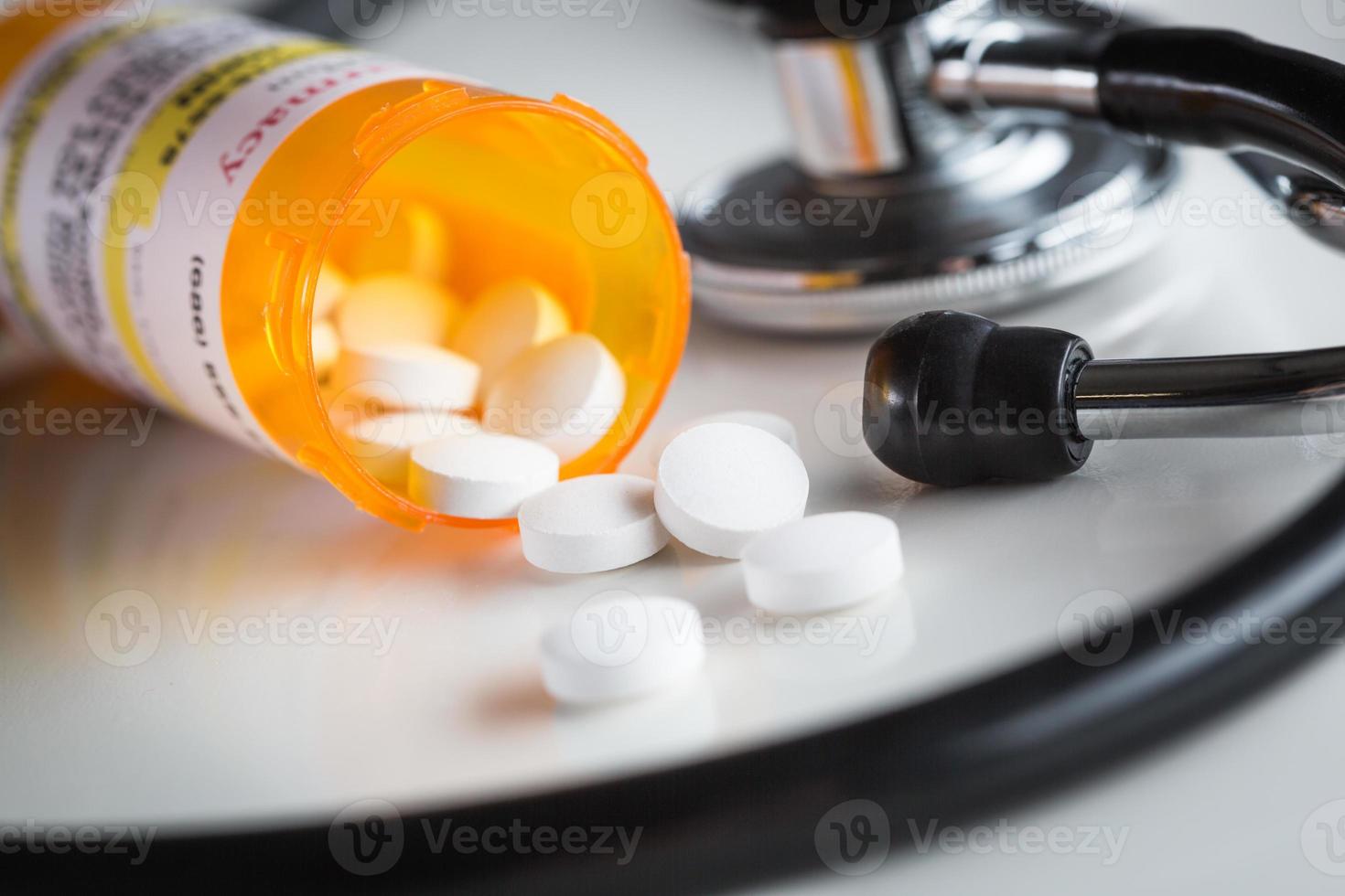 Non-Proprietary Medicine Prescription Bottles and Spilled Pills with Stethoscope photo
