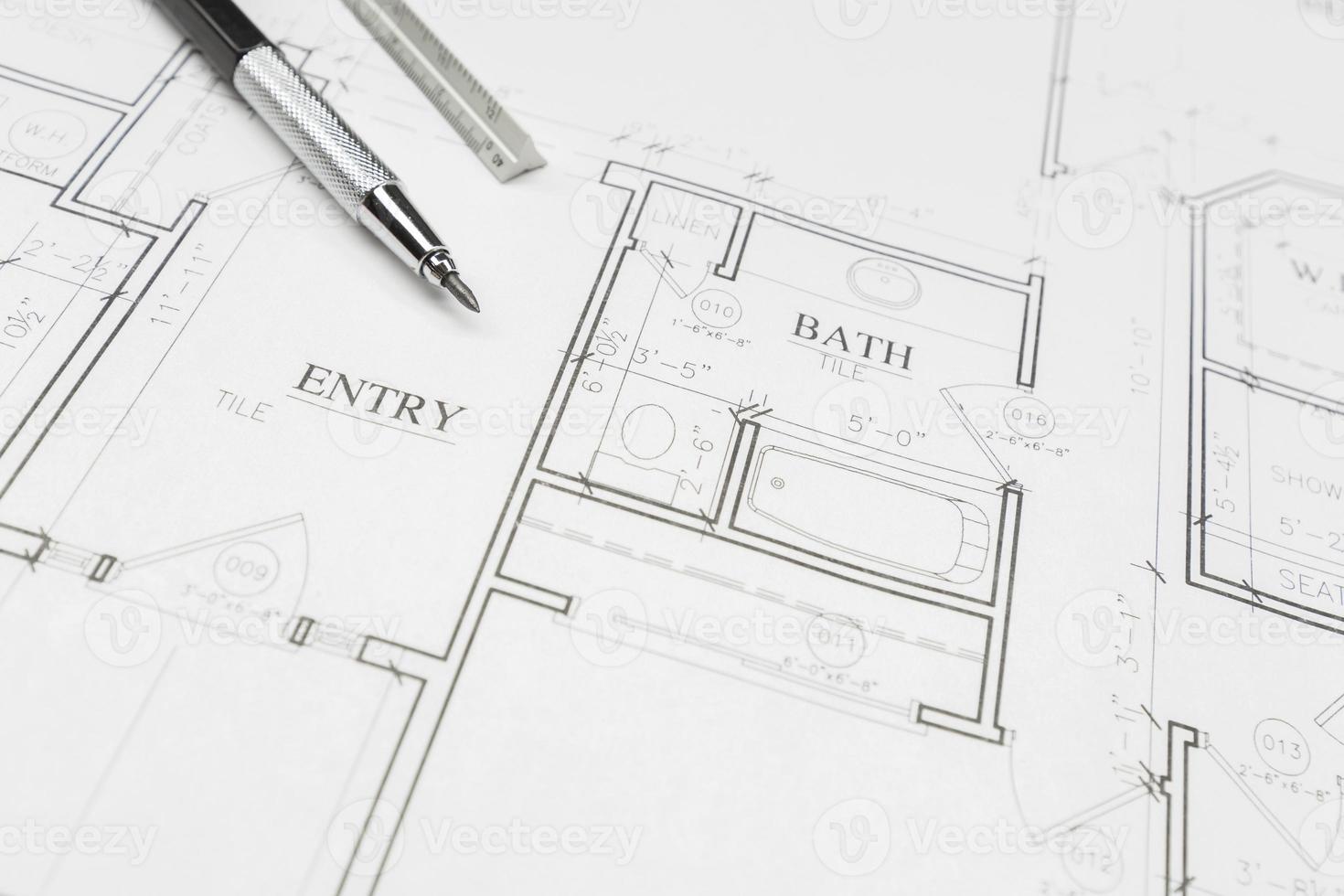 Engineer Pencil and Ruler Resting on House Plans photo