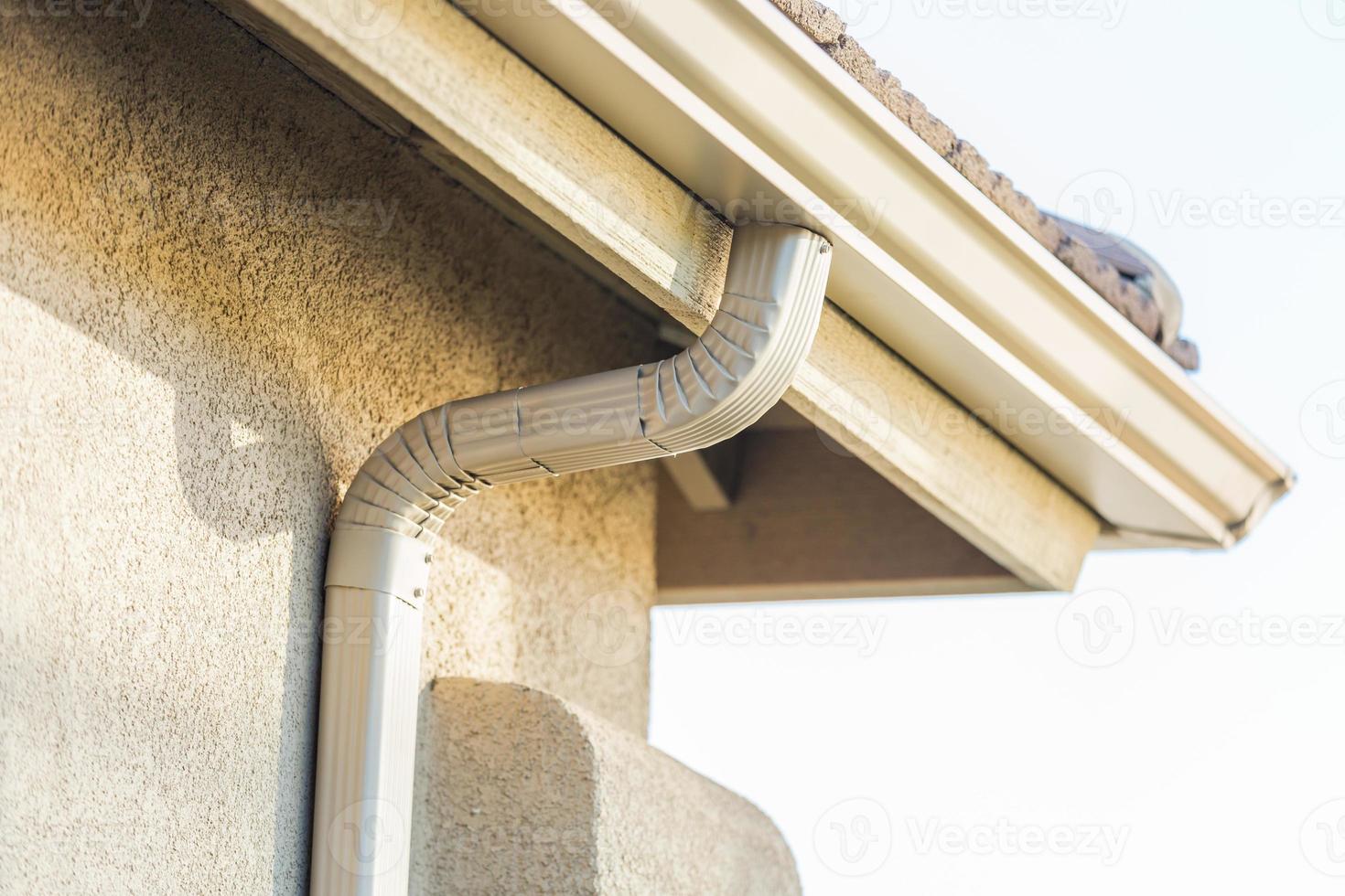 House with New Seamless Aluminum Rain Gutters. photo