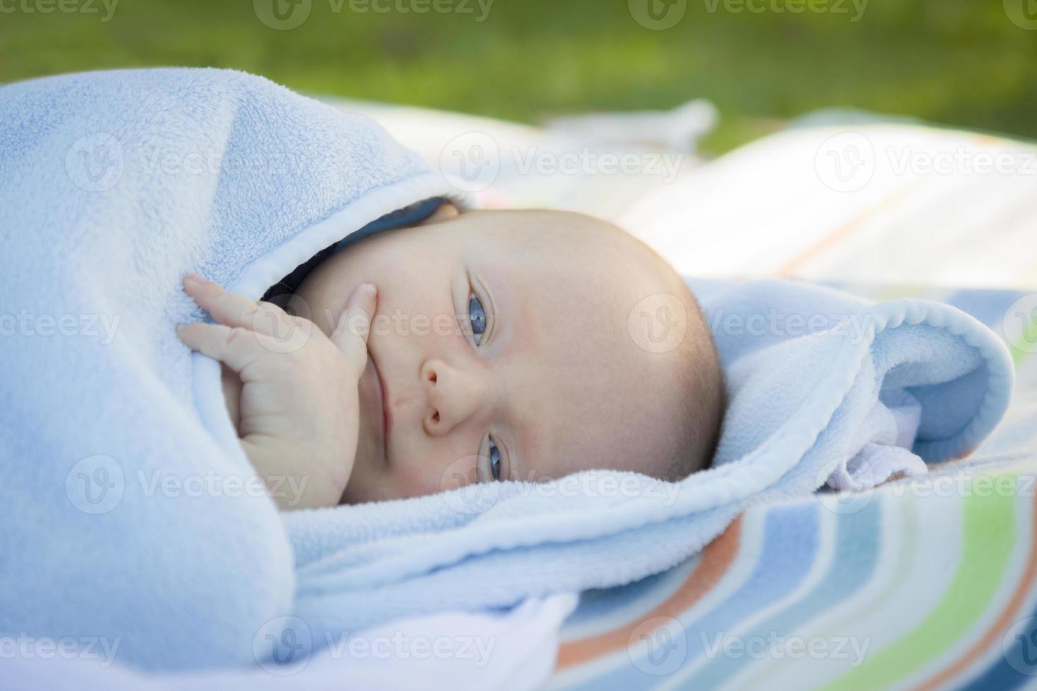 Little Baby Boy Resting in His Warm Blanket photo