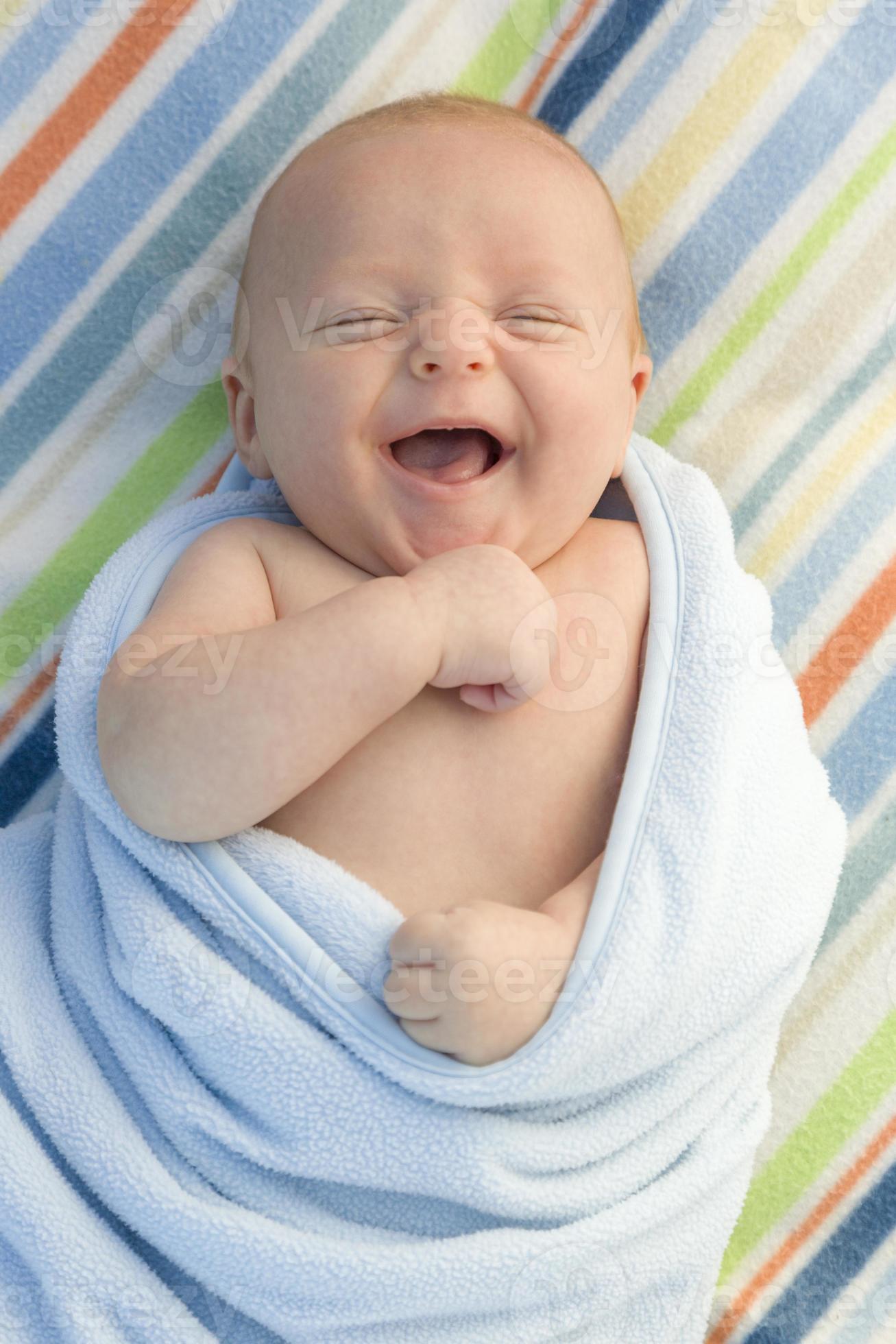 Laughing Baby Boy Wrapped in His Blanket 16419200 Stock Photo at Vecteezy