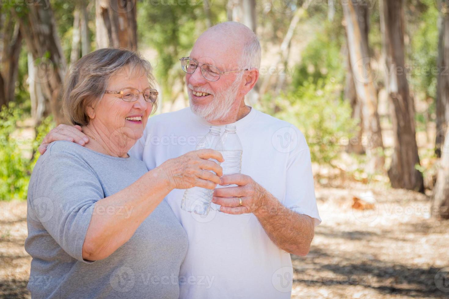 Happy Healthy Senior Couple with Water Bottles photo