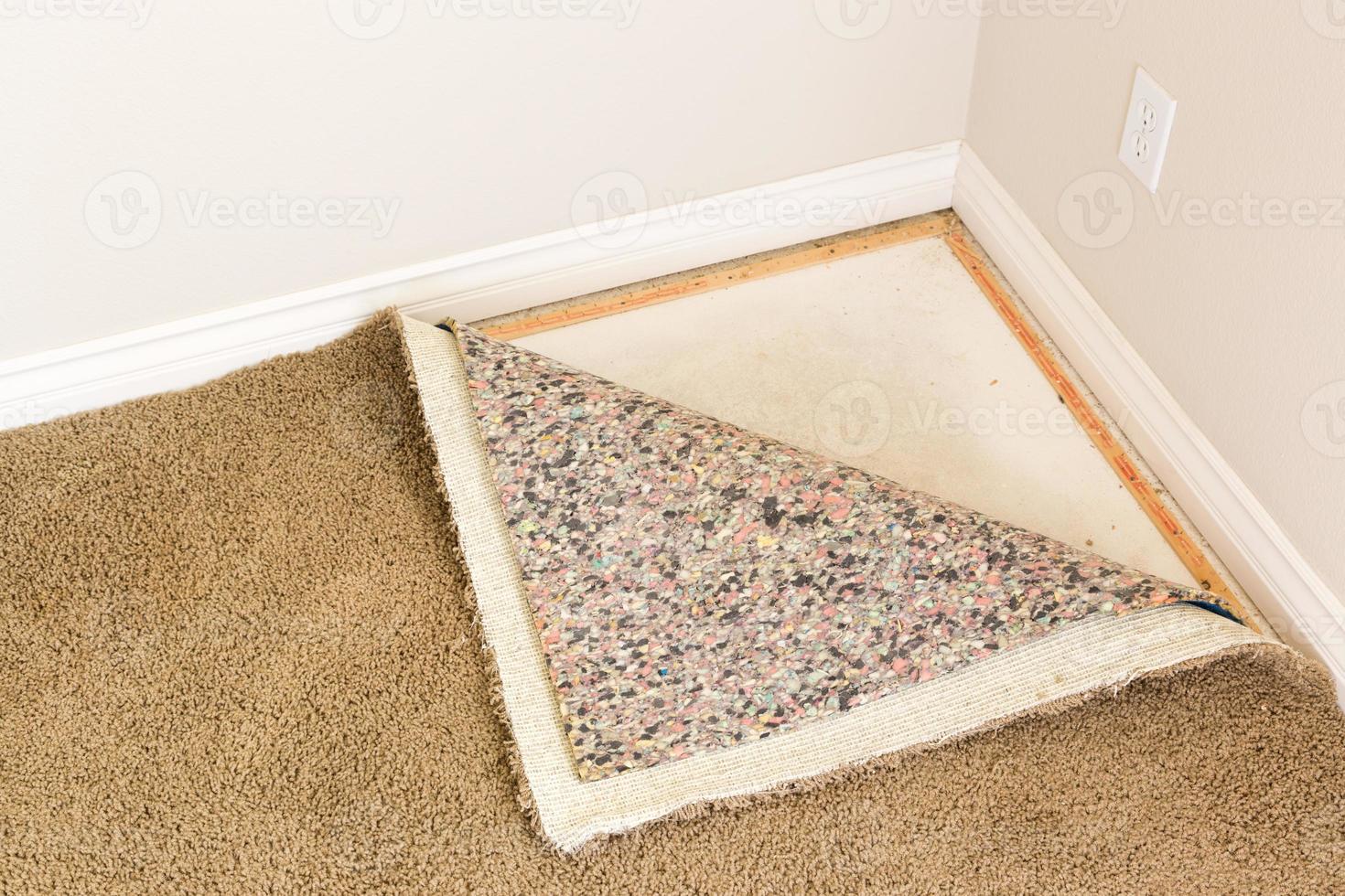 Pulled Back Carpet and Padding In Room photo