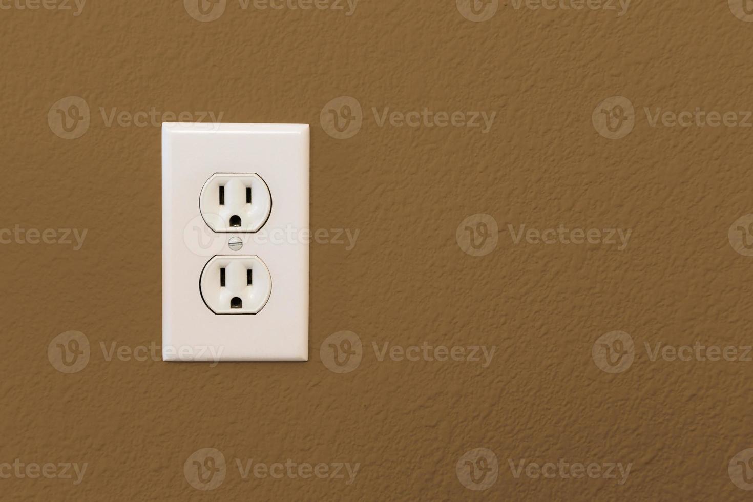 Electrical Sockets In Colorful Brown Wall photo