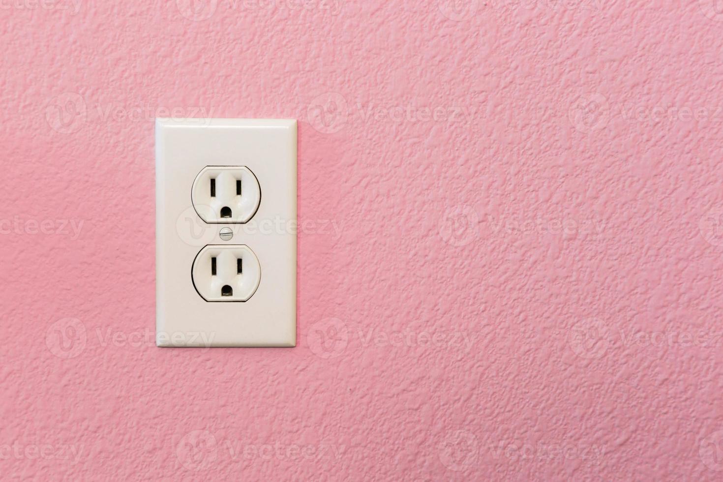 Electrical Sockets In Colorful Pink Wall photo