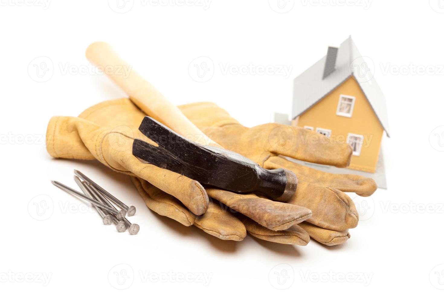 Hammer, Gloves, Nails and House photo