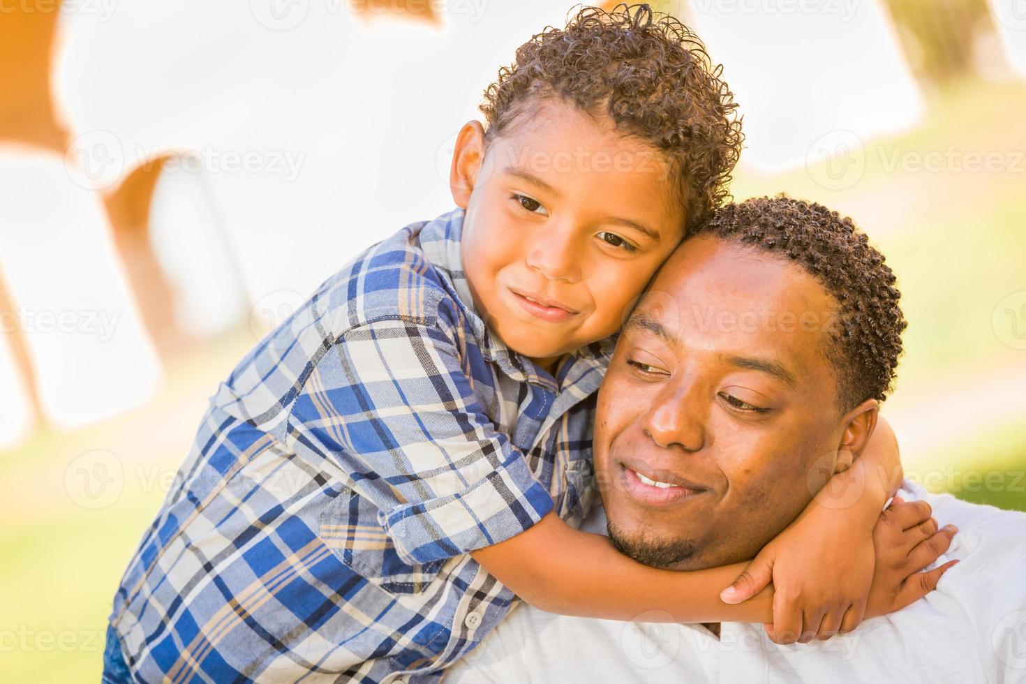 Happy African American Father and Mixed Race Son Playing At The Park photo