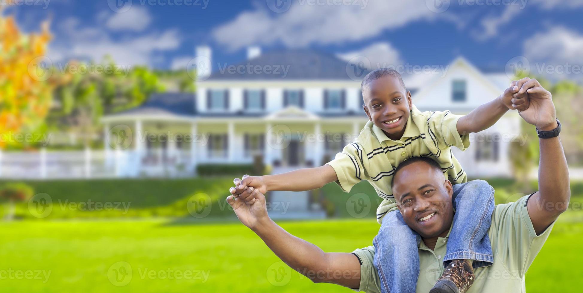 Playful African American Father and Son In Front of Home photo