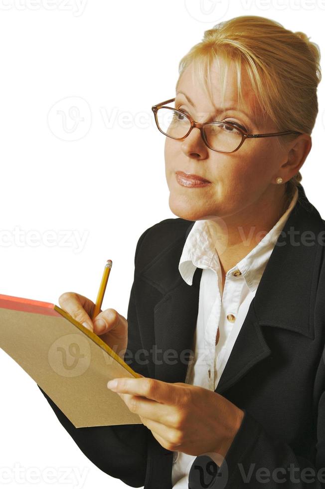 Beautiful Woman Thinks with Pencil and Notepad photo