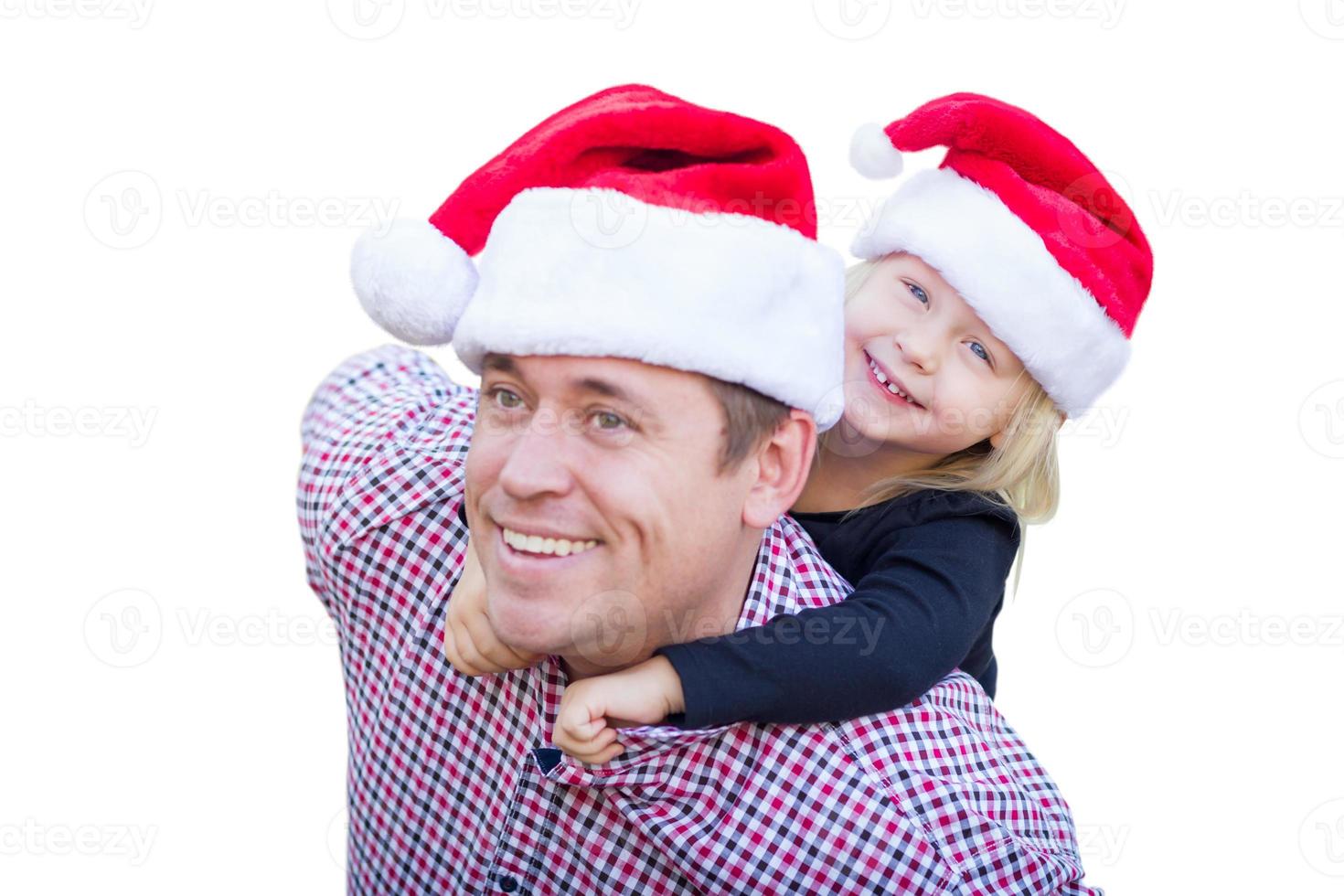 Happy Father and Daughter Wearing Santa Hats Isolated on White Background. photo