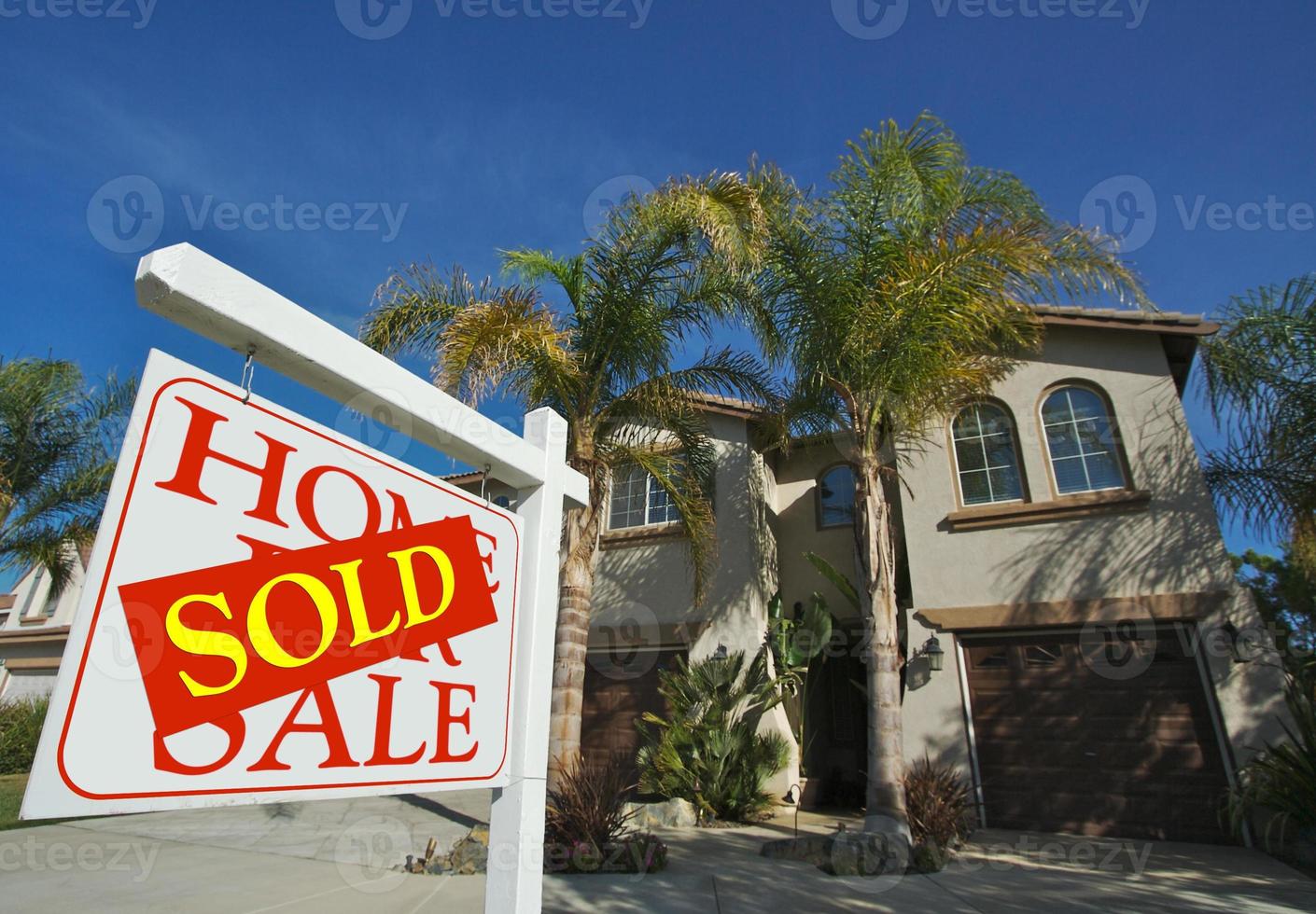 Sold Home For Sale Sign and New House photo