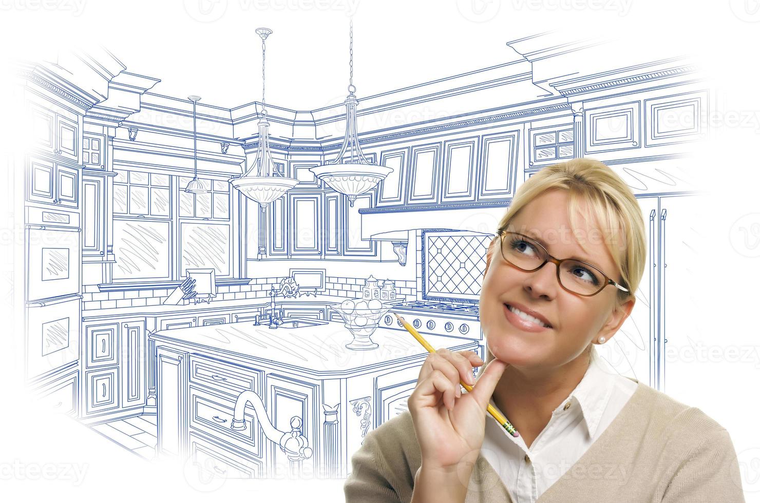 Woman With Pencil Over Custom Kitchen Design Drawing photo