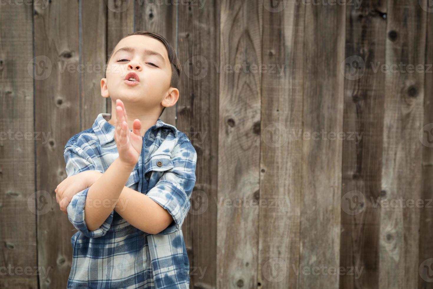 Young Mixed Race Boy Making Hand Gestures photo