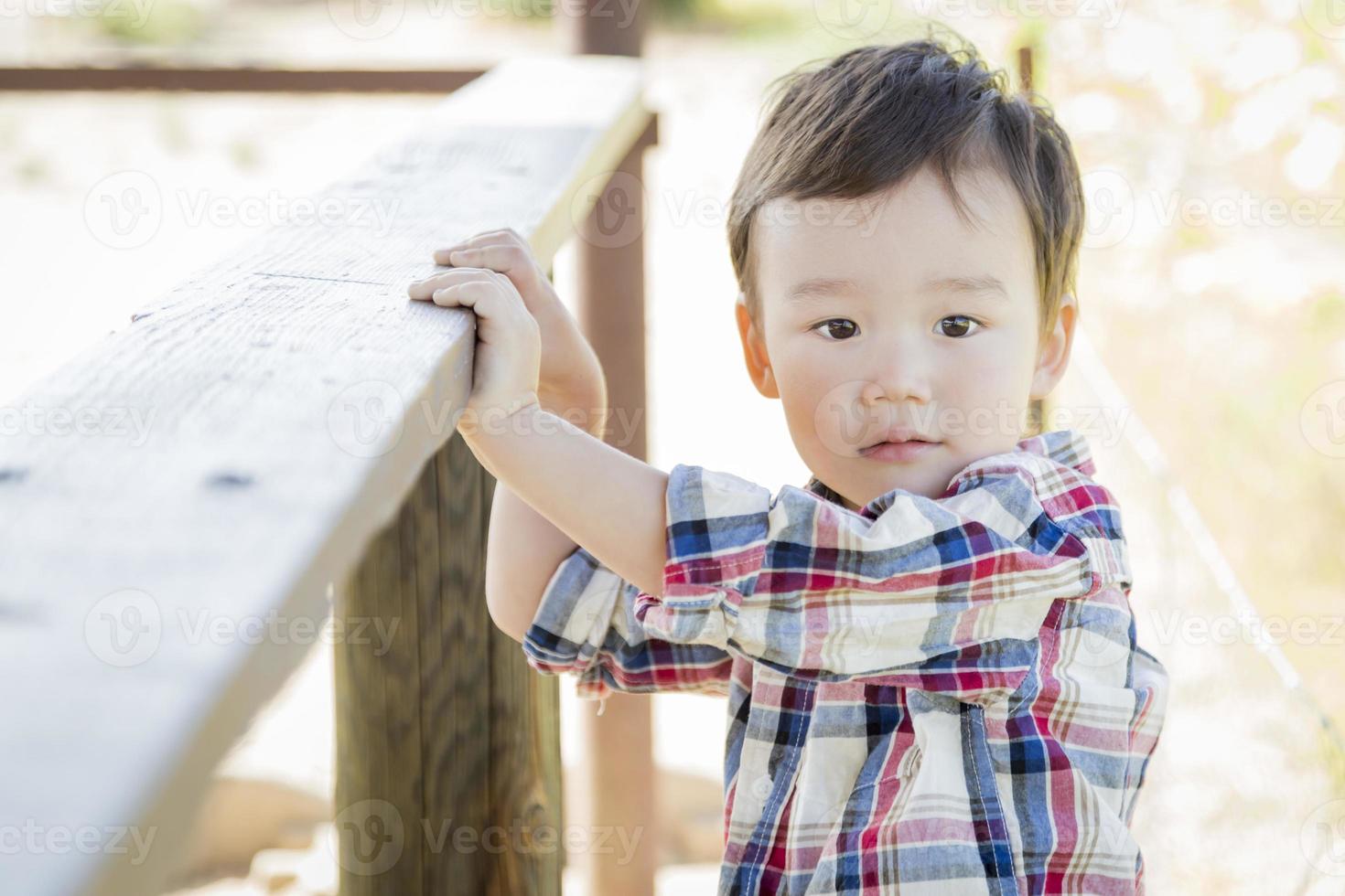 Mixed Race Young Boy Having Fun Outside photo