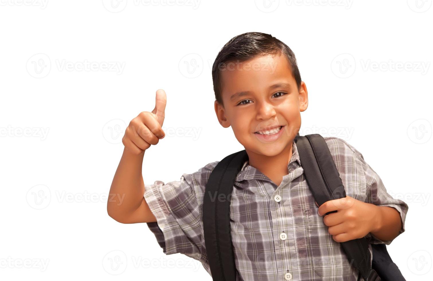 Happy Young Hispanic School Boy with Thumbs Up and Backpack Ready for School Isolated on a White Background. photo
