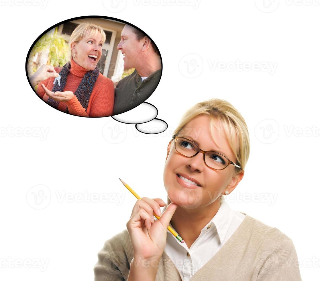 Woman with Thought Bubbles of Getting The Keys to a New Home photo