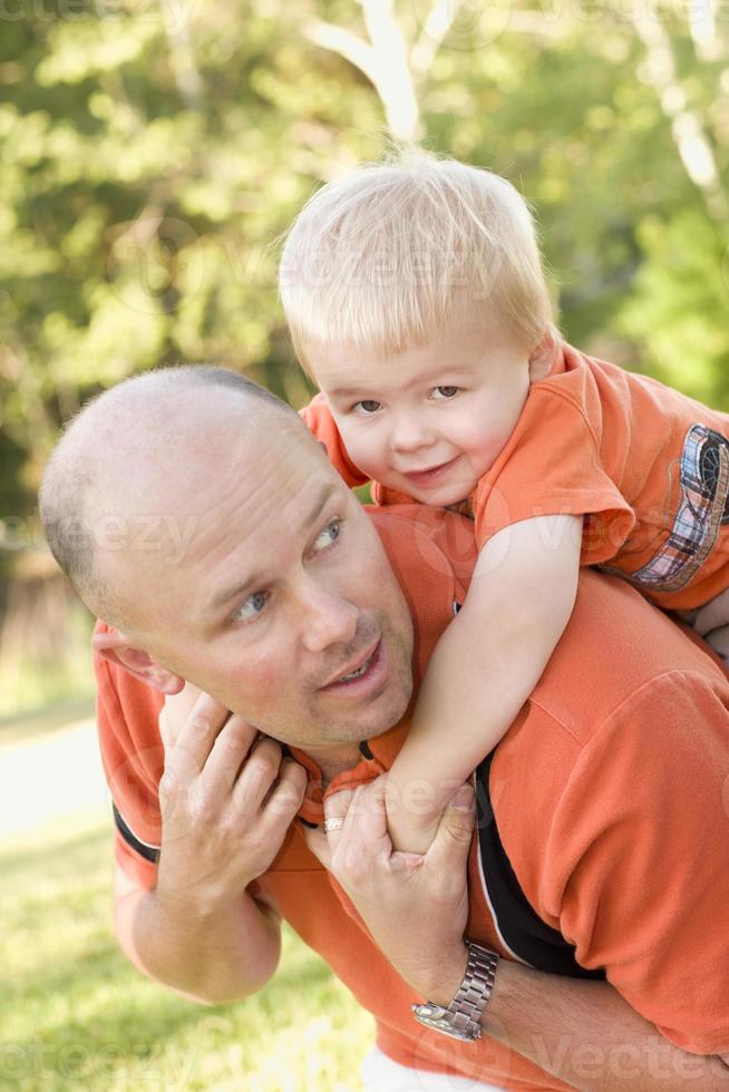 Father and Son Piggyback in the Park photo