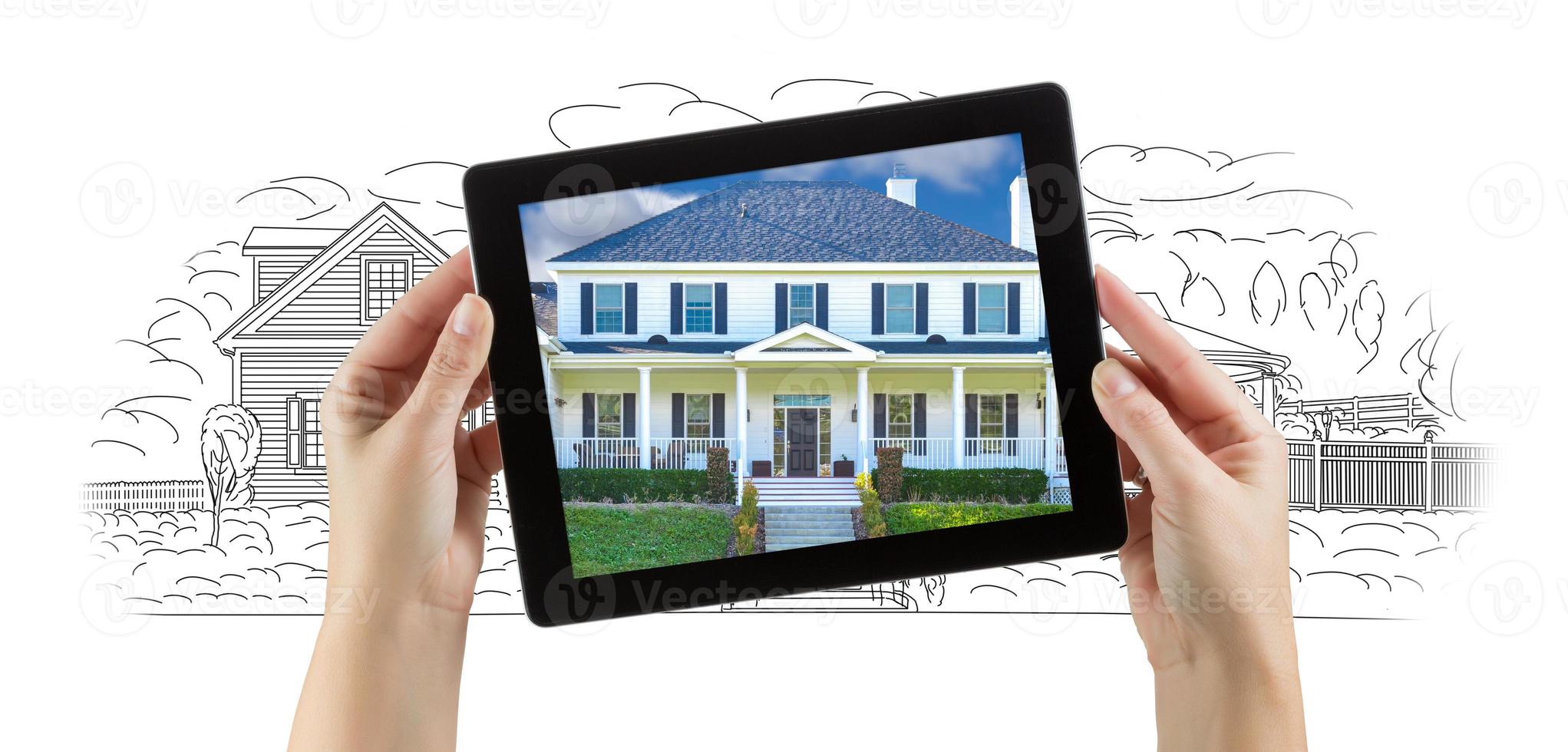 Female Hands Holding Computer Tablet with House Photo on Screen and Drawing Behind.