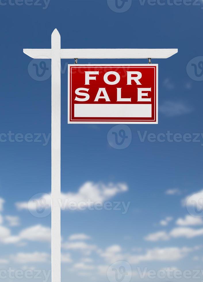 Right Facing For Sale Real Estate Sign on a Blue Sky with Clouds. photo