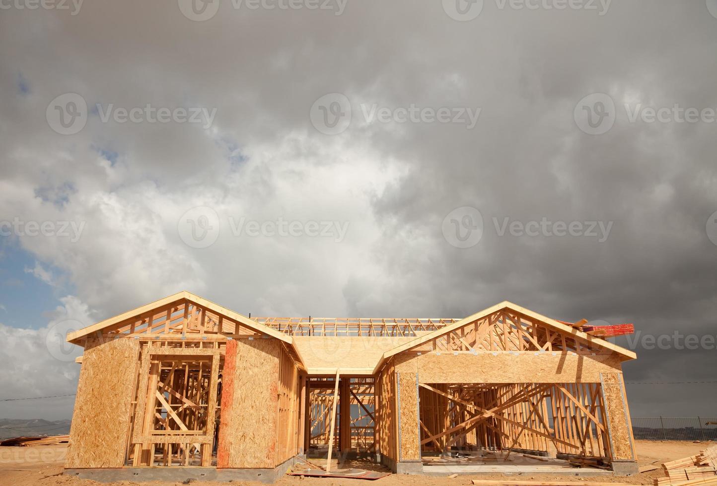 Abstract Home Construction Site and Ominous Clouds photo