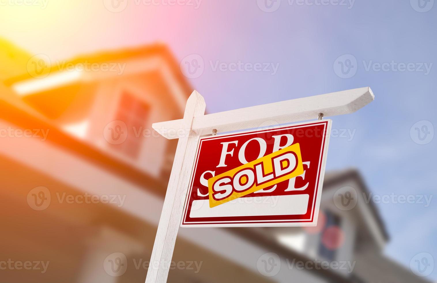 Sold Home For Sale Sign in Front of New House photo