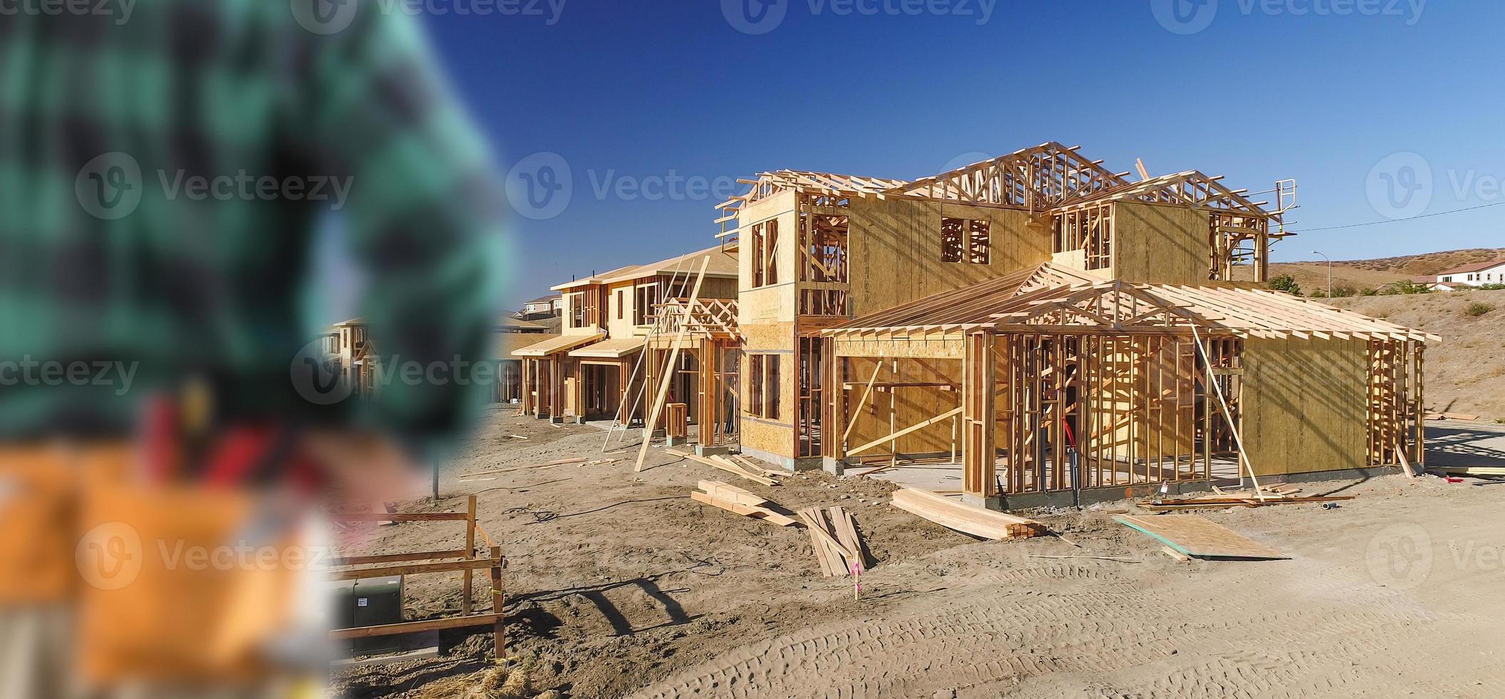 Contractor In Front New House Wood Framing at Construction Site photo