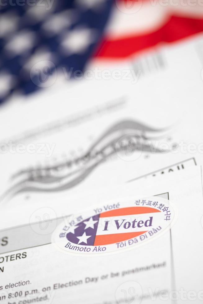 Vote-By-Mail Ballot Envelope and Voting Instructions Laying On American Flag photo