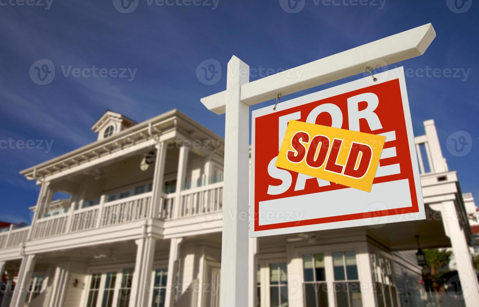 Sold Home For Sale Sign in Front of New House photo