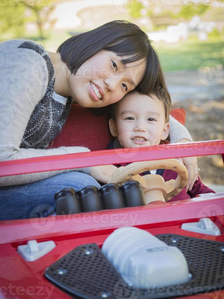 Chinese Mother Having Fun with Her Mixed Race Baby Son photo