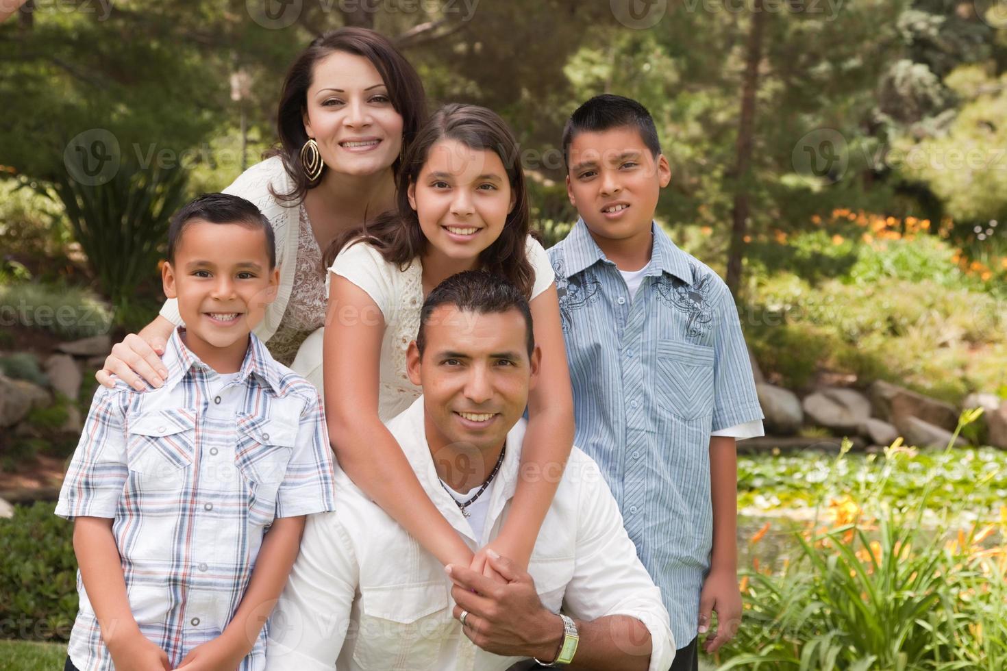 Happy Hispanic Family In the Park photo