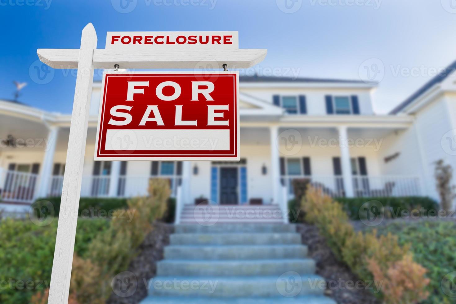 Right Facing Foreclosure For Sale Real Estate Sign in Front of House. photo