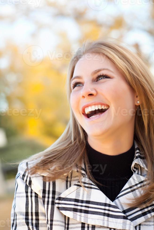 Pretty Young Woman Smiling in the Park photo