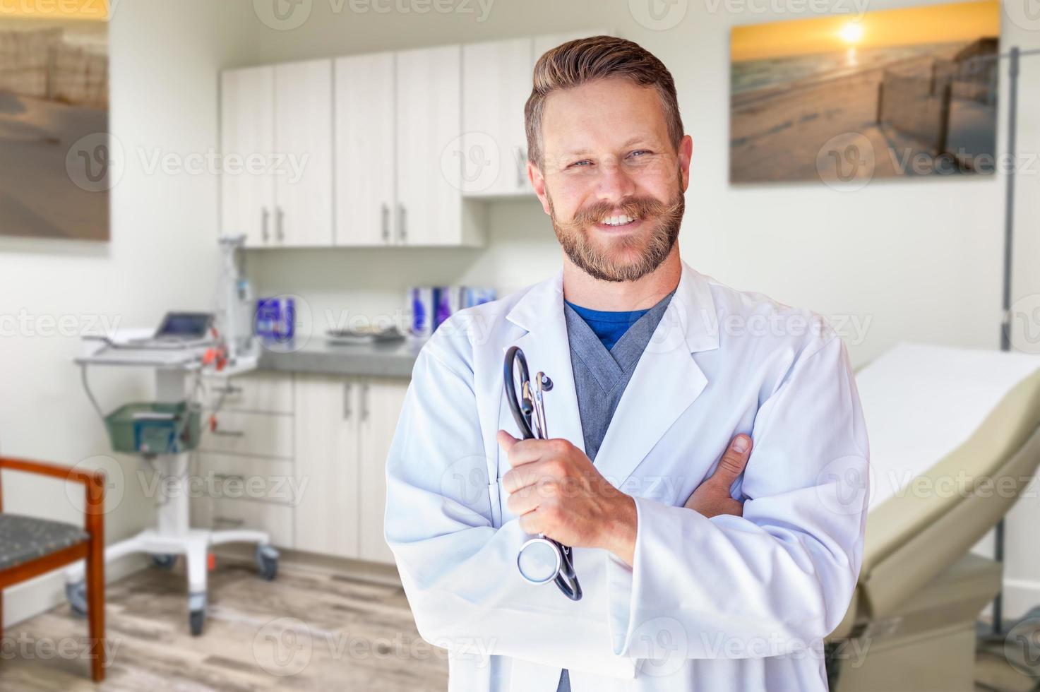 Caucasian Male Doctor Standing In Office photo