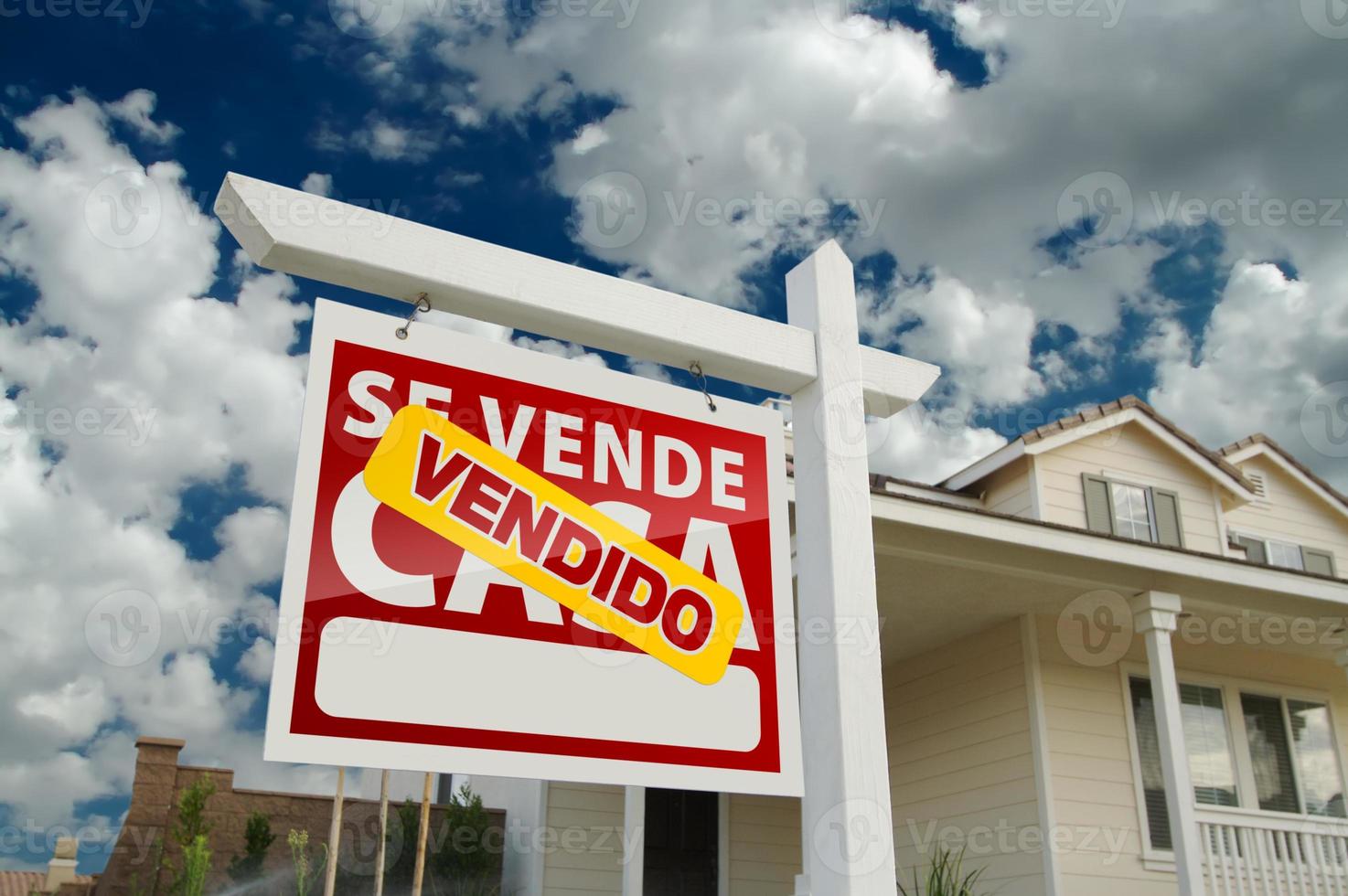 Spanish Sold Home for Real Estate Sale Sign photo