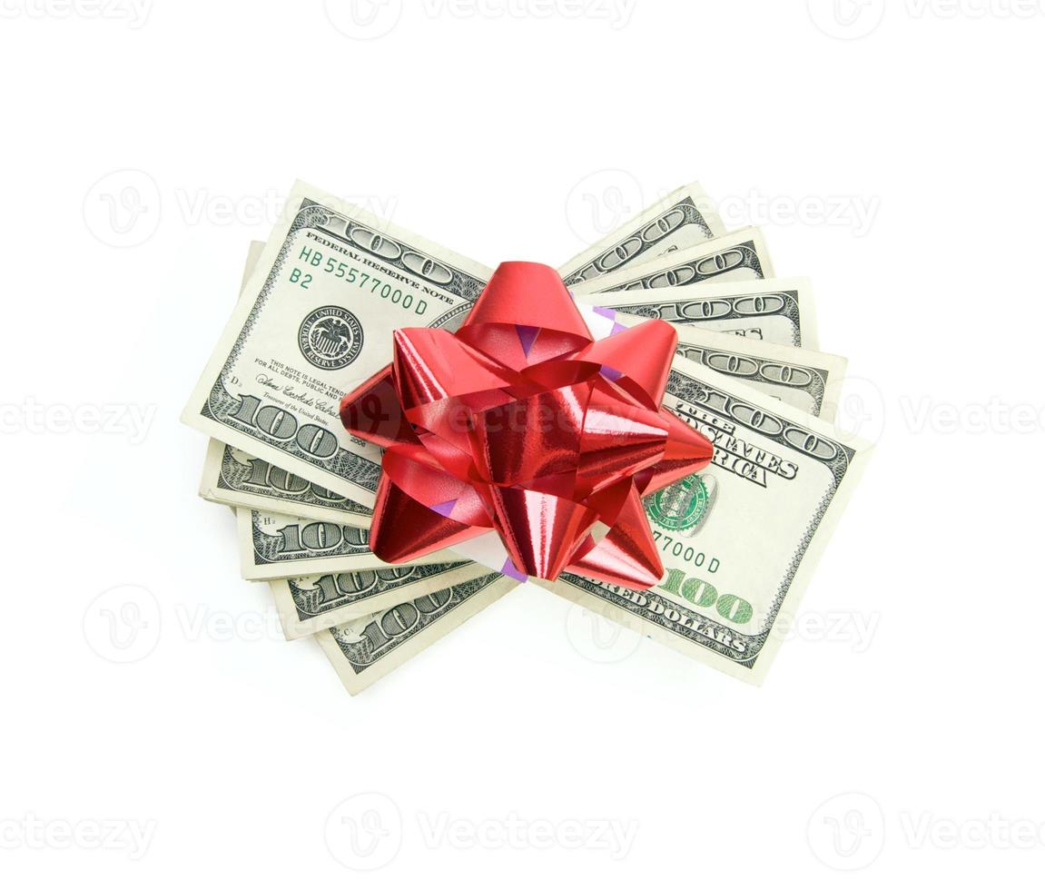 Stack of Money with Bow Isolated on a White Background photo