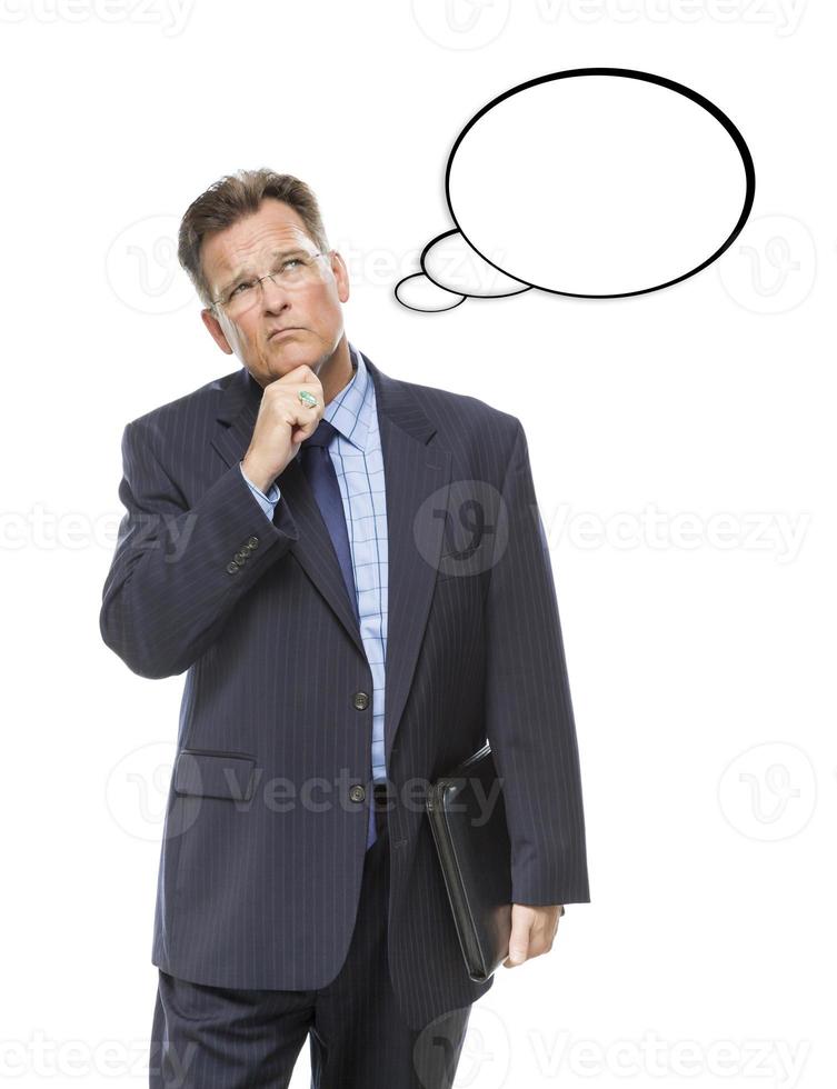 Pensive Businessman Looking Up At Blank Thought Bubble photo