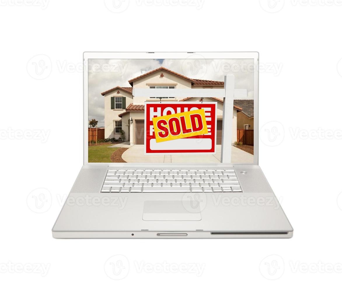 Sold For Sale Real Estate Sign on Laptop photo