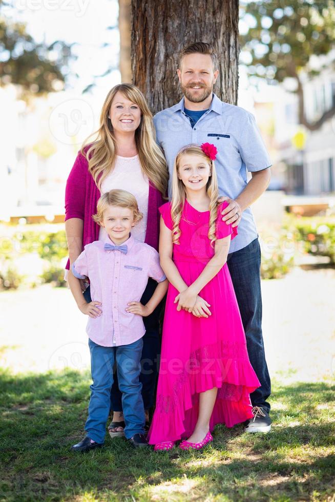 Happy Attractive Young Caucasian Family Portrait in the Park photo