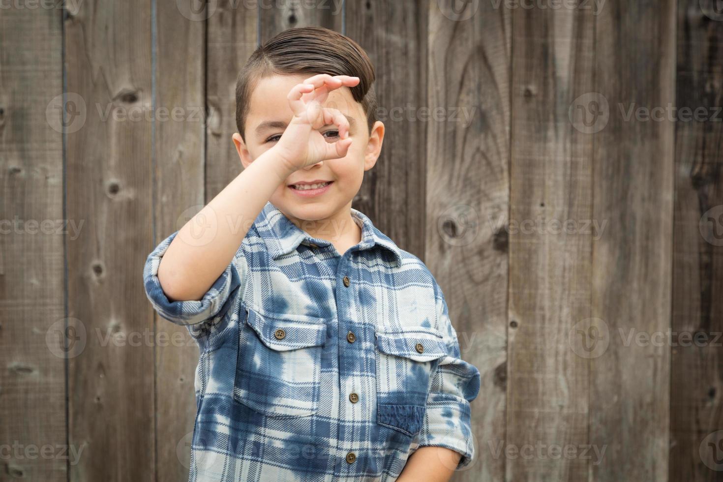 Young Mixed Race Boy Making Hand Gestures photo